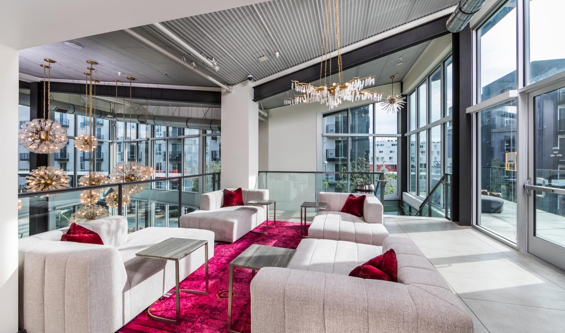 Find your perfect fit at Aliso Apartments a room with a couch and a table with chairs