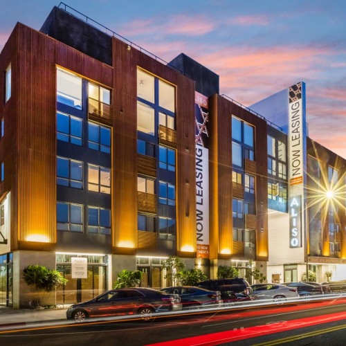 The essence of exceptional living a building with a sign on it